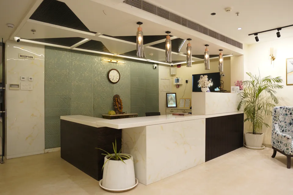 The warm, gold-lit reception of Hotel Janki Palace